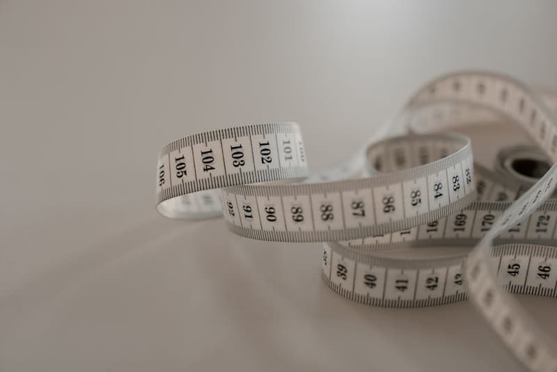 A ruler and measuring tape showing metric and imperial units side by side